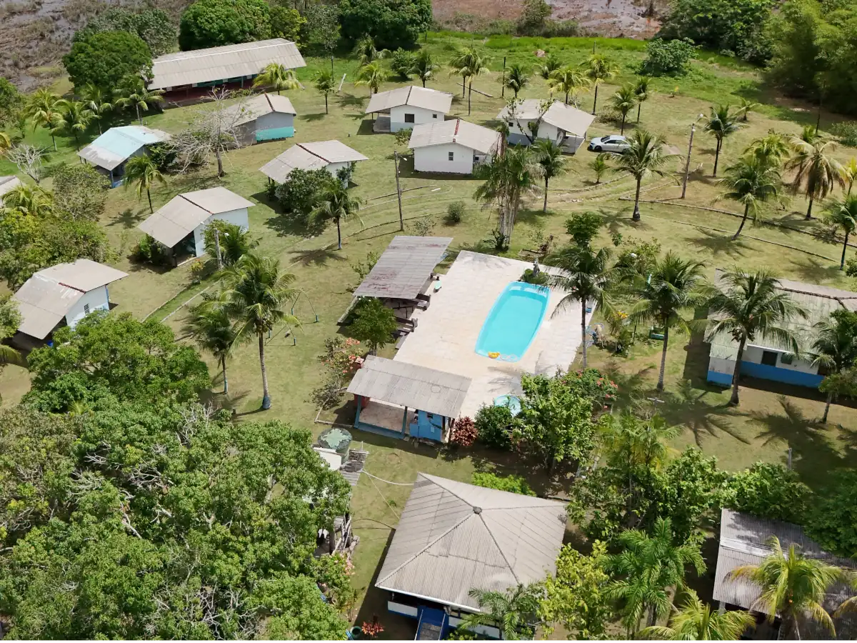 Aerial view of the pool and leisure area, surrounded by chalets